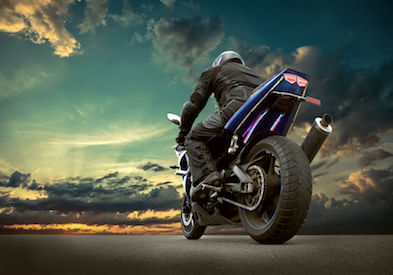 59778482 - man seat on the motorcycle under sky with clouds