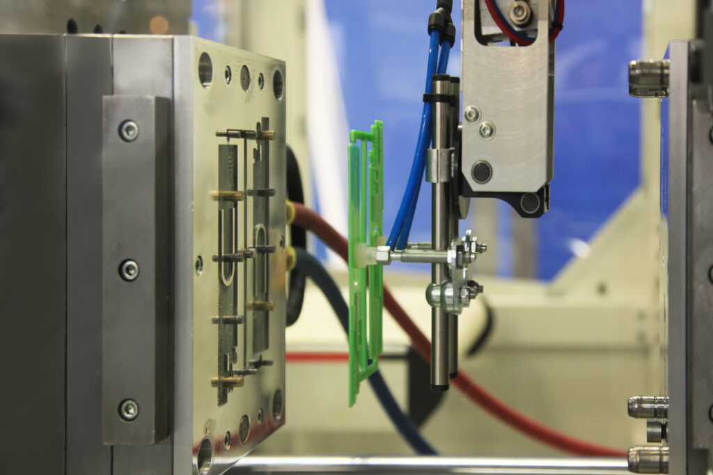 Plastic injection molding equipment used in ISO 9001:2015 certified manufacturing for multiple industries.